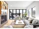 Cozy living room with fireplace, comfortable seating, large windows, and neutral color palette at 754 S York St, Denver, CO 80209