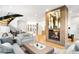 Bright living room features a modern fireplace, sleek staircase, and inviting neutral decor at 754 S York St, Denver, CO 80209