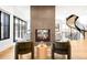 Bright living room featuring a modern fireplace, spiral staircase, and comfortable seating at 754 S York St, Denver, CO 80209