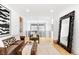 Spacious landing area with stylish furniture, iron railings, and abundant natural light at 754 S York St, Denver, CO 80209
