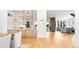 Open living space features kitchen island, dining area, and view to living room at 754 S York St, Denver, CO 80209