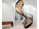 Unique spiral staircase with wooden steps and black railing, adding architectural interest to the home at 754 S York St, Denver, CO 80209