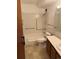 Full bathroom features a shower and tub combination with dark wood vanity and a tiled wall at 795 S Alton Way # 11C, Denver, CO 80247