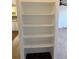 A built-in bookcase is shown with carpet and luxury vinyl tile on the surrounding floor at 795 S Alton Way # 11C, Denver, CO 80247