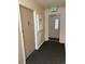 Hallway with neutral colors, and an exit sign for safety and direction at 795 S Alton Way # 11C, Denver, CO 80247