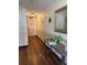 Well-lit hallway with stylish console table and tasteful decor at 795 S Alton Way # 11C, Denver, CO 80247