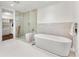 Spa-like bathroom featuring a soaking tub and a walk-in shower at 250 Columbine St # 210, Denver, CO 80206