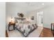 Spacious bedroom with hardwood floors, ceiling fan and access to the bathroom at 250 Columbine St # 210, Denver, CO 80206