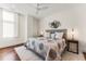 Bright bedroom with hardwood floors, ceiling fan, and plenty of natural light at 250 Columbine St # 210, Denver, CO 80206