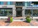 Modern building exterior with glass and stone accents, showcasing a welcoming entrance at 250 Columbine St # 210, Denver, CO 80206