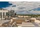 Modern rooftop deck features a firepit and seating area at 250 Columbine St # 210, Denver, CO 80206