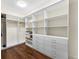 Spacious walk-in closet featuring custom shelving and drawers at 250 Columbine St # 210, Denver, CO 80206