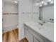 Modern bathroom featuring a tiled shower and a gray vanity with a sink at 389 S Kalispell Way # C, Aurora, CO 80017