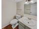 Bathroom featuring a toilet, sink, vanity and bright lighting at 389 S Kalispell Way # C, Aurora, CO 80017