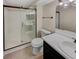 Bathroom featuring a glass enclosed shower, white toilet and vanity, and modern fixtures at 389 S Kalispell Way # C, Aurora, CO 80017