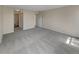 Spacious bedroom featuring plush carpeting, neutral paint, and direct access to the bathroom at 389 S Kalispell Way # C, Aurora, CO 80017