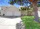 Charming home featuring a two-car garage, well-manicured lawn, and mature trees at 389 S Kalispell Way # C, Aurora, CO 80017
