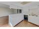 Open kitchen featuring a breakfast bar, white cabinets, and stainless steel appliances at 389 S Kalispell Way # C, Aurora, CO 80017