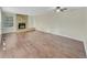 Spacious living room with hardwood floors and a stone fireplace at 389 S Kalispell Way # C, Aurora, CO 80017
