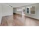 Bright living room featuring hardwood floors, a ceiling fan, and a view into the kitchen at 389 S Kalispell Way # C, Aurora, CO 80017