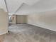 Spacious living room featuring neutral walls, carpet, and a window letting in natural light at 389 S Kalispell Way # C, Aurora, CO 80017