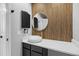 Stylish powder room with unique wood slat wall, vessel sink, and modern fixtures at 13254 E Asbury Dr, Aurora, CO 80014
