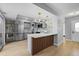 Modern kitchen with gray cabinets, stainless steel appliances, and a unique backsplash at 13254 E Asbury Dr, Aurora, CO 80014