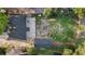 Aerial view of a home with a spacious yard and a concrete driveway, offering ample outdoor potential at 1636 Geneva St, Aurora, CO 80010