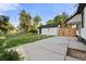 Spacious backyard with a shed, concrete patio, and wood fence at 1636 Geneva St, Aurora, CO 80010