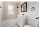 Updated bathroom with modern fixtures, vanity, and shower-tub combo at 1636 Geneva St, Aurora, CO 80010
