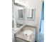 Bright bathroom showcases a granite countertop, vanity mirror, and leads to connecting rooms at 17090 E Ford Dr # 209, Aurora, CO 80017