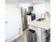 Well-lit kitchen featuring stainless steel appliances and a stylish breakfast bar at 17090 E Ford Dr # 209, Aurora, CO 80017