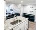 Modern kitchen with granite countertops, stainless steel sink, and an open layout at 17090 E Ford Dr # 209, Aurora, CO 80017