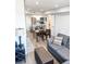 Open-concept living area with a modern kitchen, dining area, and comfortable seating at 17090 E Ford Dr # 209, Aurora, CO 80017