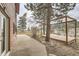 Backyard features a wooden deck and a view of mountains and trees at 26167 De Berry St, Conifer, CO 80433