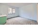 Bedroom with neutral walls, carpeted floors, and a window at 26167 De Berry St, Conifer, CO 80433