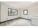 Bright bedroom features neutral walls, carpeted floors, and two windows with beautiful views at 26167 De Berry St, Conifer, CO 80433