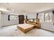 Large main bedroom features a skylight, carpeted floors, and big windows with views at 26167 De Berry St, Conifer, CO 80433