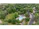 Aerial view of the community pool and play area surrounded by lush landscaping at 4 Doral Ln, Littleton, CO 80123