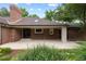 Spacious backyard with patio, brickwork, and room for entertaining and enjoying nature at 4 Doral Ln, Littleton, CO 80123