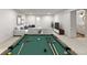 Finished basement with a pool table, L-shaped couch and TV perfect for entertainment at 4 Doral Ln, Littleton, CO 80123