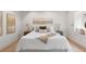 Comfortable bedroom with plush bedding, modern lamps and cozy window seat at 4 Doral Ln, Littleton, CO 80123