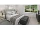 Comfortable bedroom featuring a large window, neutral decor and a cozy gray blanket at 4 Doral Ln, Littleton, CO 80123