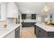 Bright kitchen with stainless steel appliances, quartz countertops, and modern cabinetry at 4 Doral Ln, Littleton, CO 80123