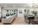 Modern living room with natural lighting, hardwood floors, and an open concept layout at 4 Doral Ln, Littleton, CO 80123