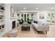 Bright and airy living room with fireplace, built-in shelving, and comfortable seating, perfect for Gathering gatherings at 4 Doral Ln, Littleton, CO 80123
