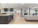 Spacious living room features an open floor plan with modern fireplace and stylish built-in shelves at 4 Doral Ln, Littleton, CO 80123