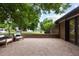 Enjoy outdoor living on this home's brick patio, perfect for relaxing and entertaining at 4 Doral Ln, Littleton, CO 80123