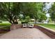 Inviting outdoor patio area with comfortable seating, perfect for relaxation and enjoying the surrounding view at 4 Doral Ln, Littleton, CO 80123