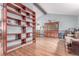 Inviting dining area featuring a large wooden bookcase, and wood-look flooring at 18206 E Loyola Dr, Aurora, CO 80013